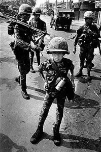 Called “Little Tiger” for killing two “Vietcong women cadre” by Philip Jones Griffiths. (1968. Magnum Photos.)